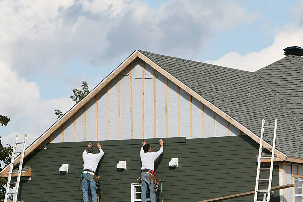 Professional Storm Damage Siding Repair technician working in Preston, MN
